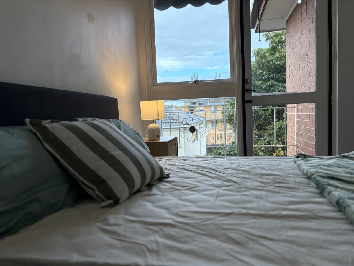 Chic sunlit bedroom in a minimalist apartment