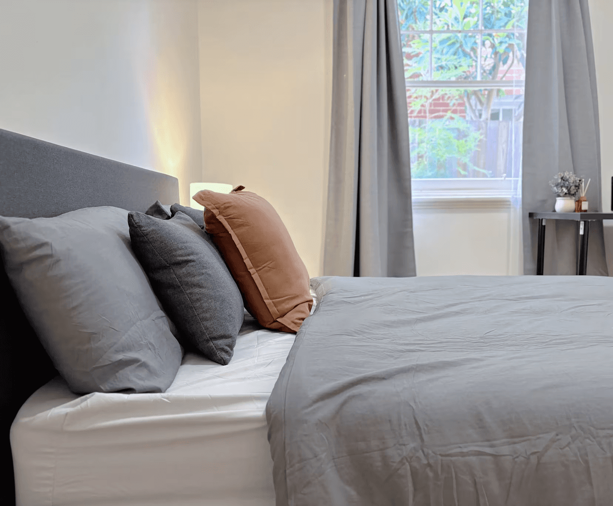 Spacious loft bedroom with industrial windows
